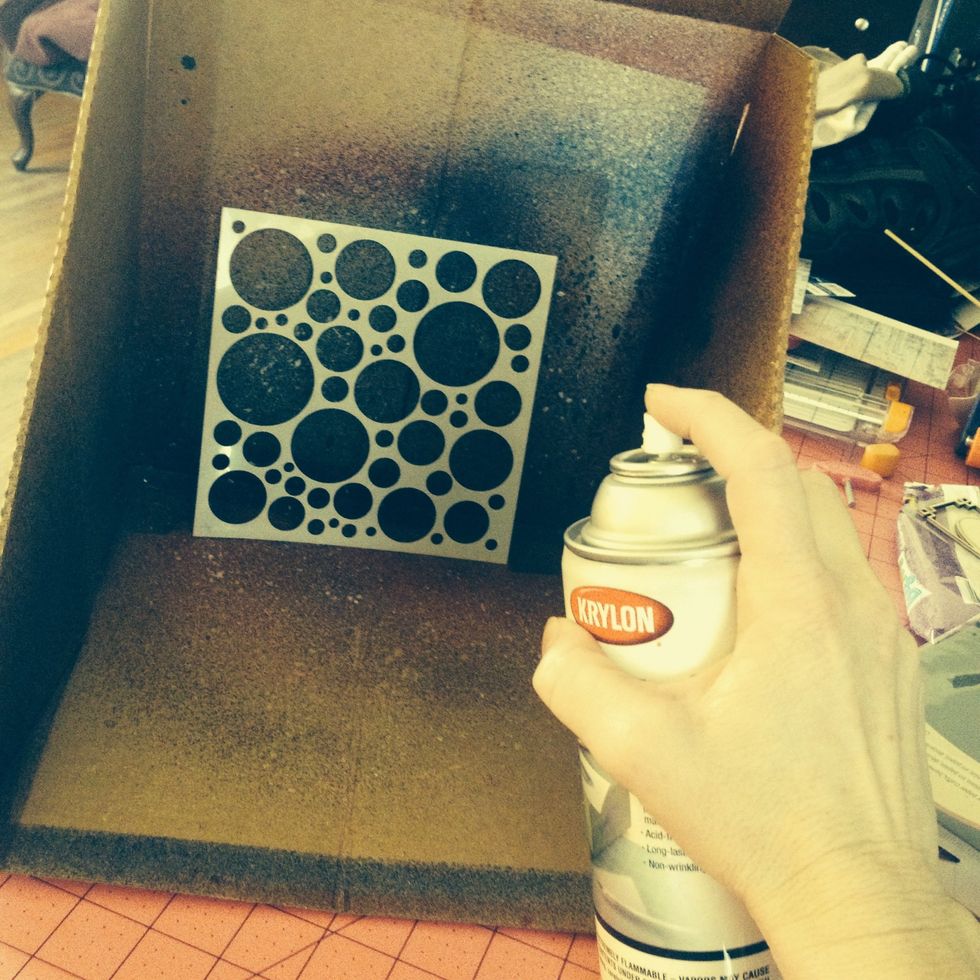Lightly spray over the BACK of your stencil