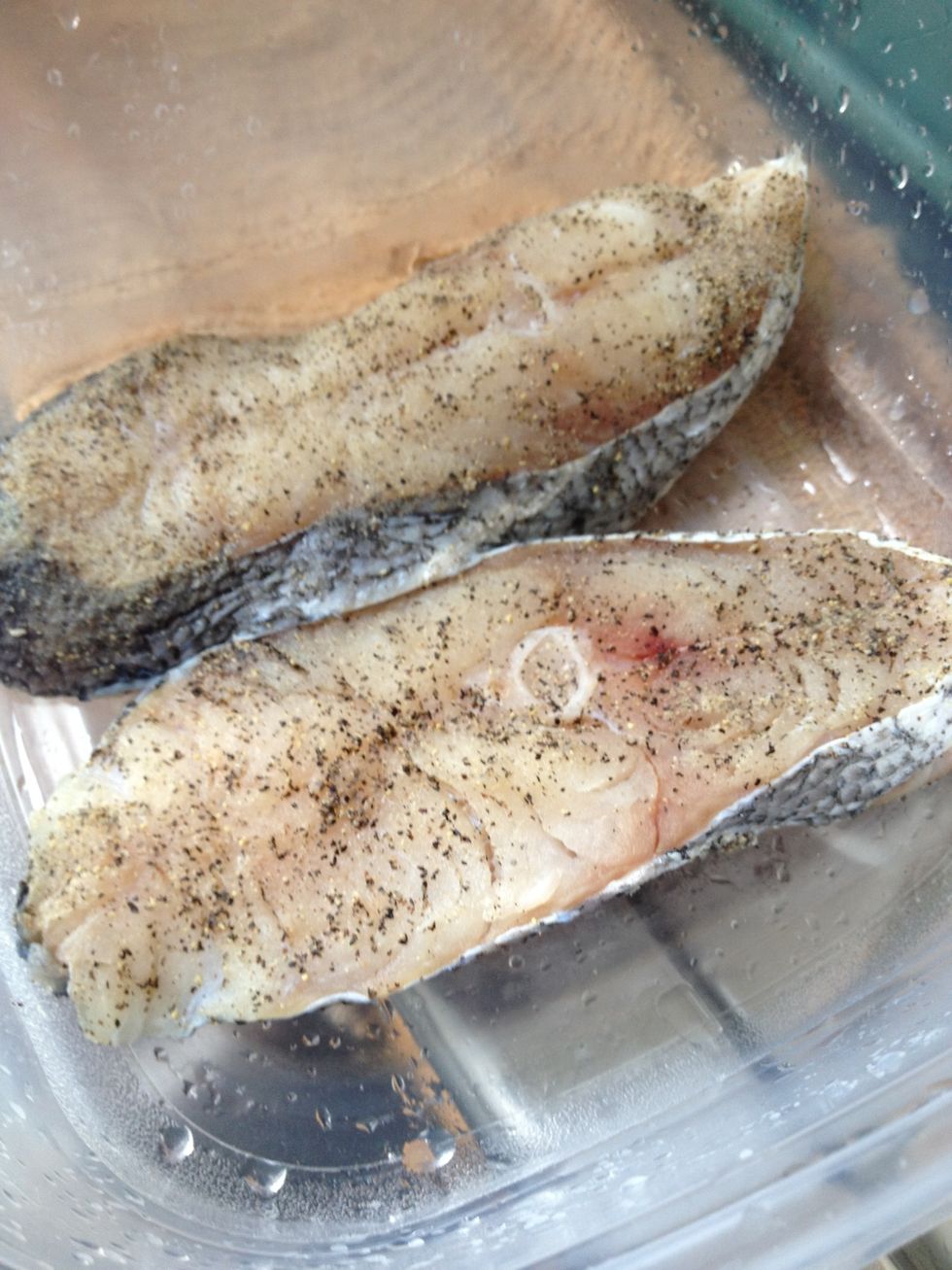 Lightly spread black pepper and salt mix to both sides of fish.