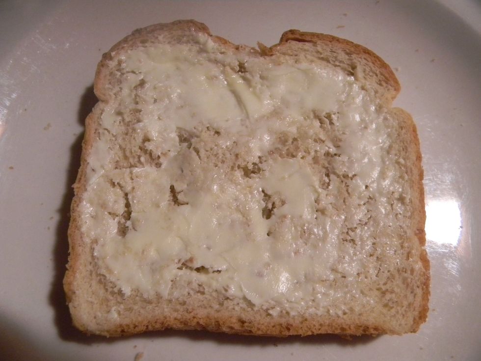 Lightly spread butter across the top.