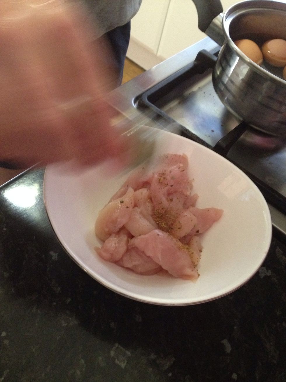 Lightly sprinkle Cajan seasoning onto chicken.