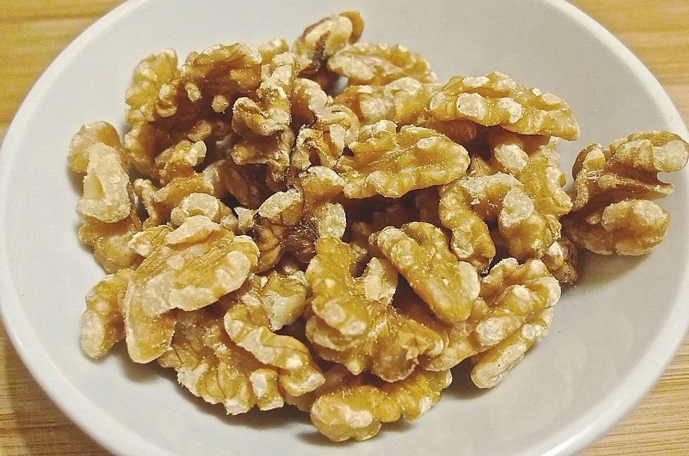 Lightly toast walnuts in oven or non stick pan for 8 to 10 minutes. Let cool and chopped walnuts coarsely.