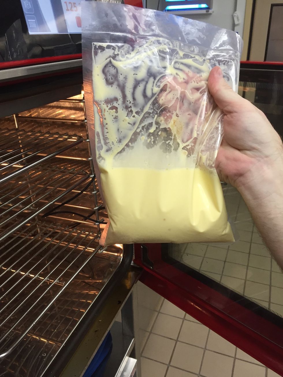 Lightly whisk all ingredients to break up the egg and seal in a kryovac bag. Place into the oven.