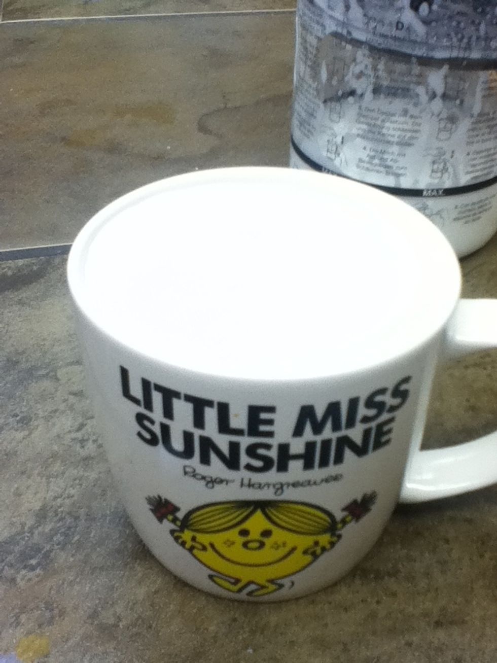 Like my spiffy mug? Okay now pour in the tea (take the bag out of the cup) and pour in vanilla and sugar then stir. Next spoon in froth and pout the rest of the milk in.