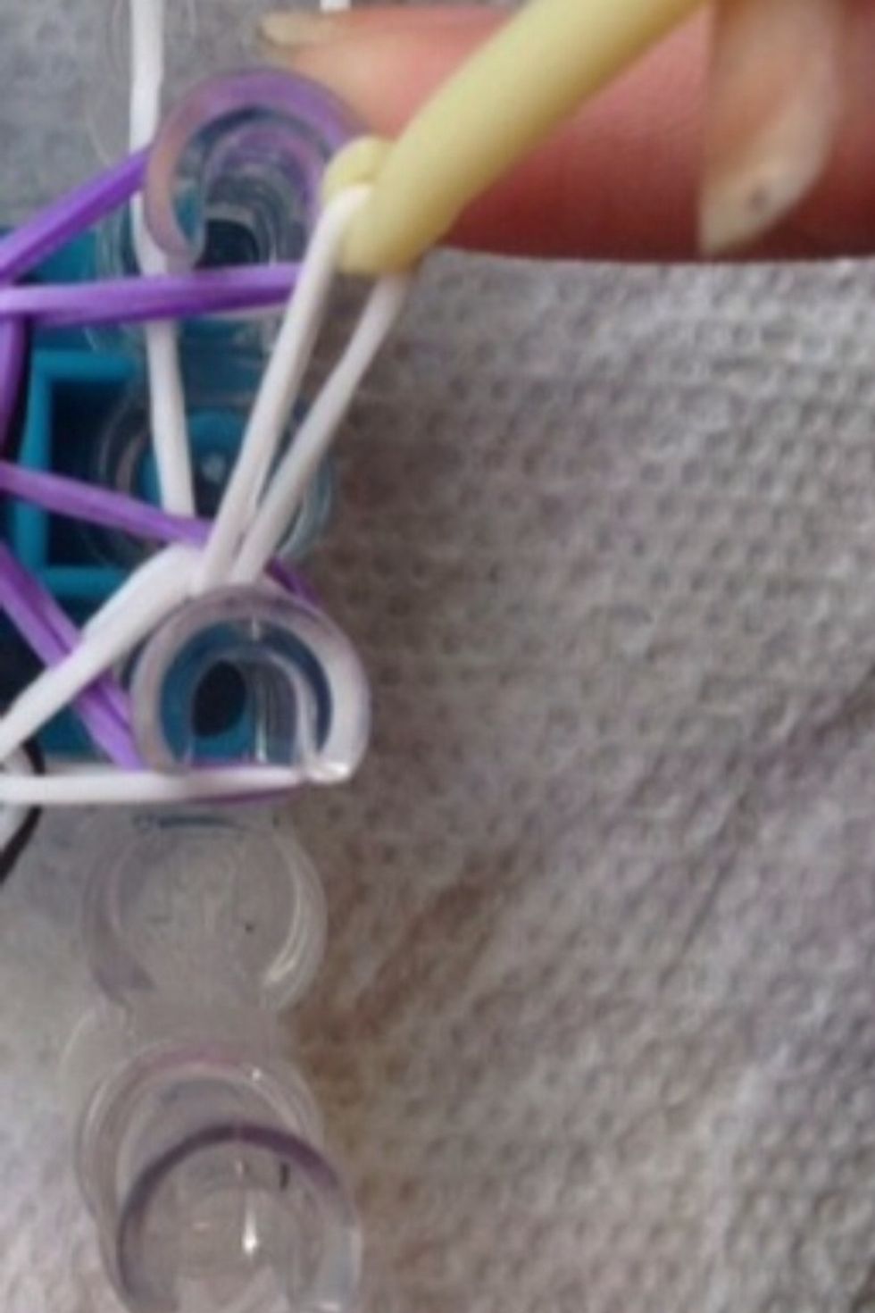 Like so. Go through the peg and grab the bottom band (the band I showed you in the pervious step).