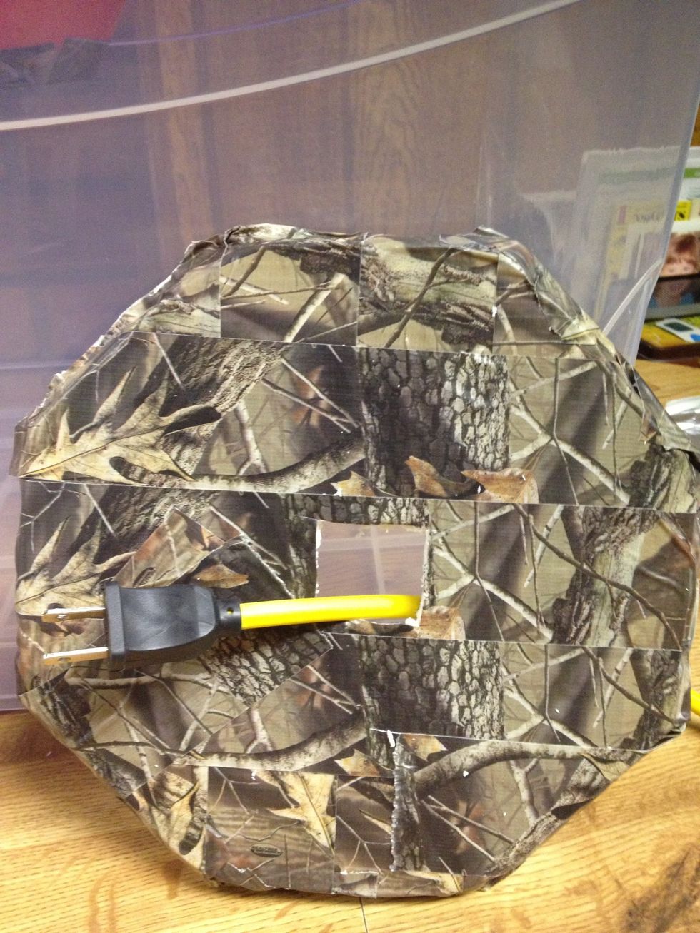 Like so. Now pass the power cord all the way through so the light will be suspended in the baffling we just finished making. Almost done!