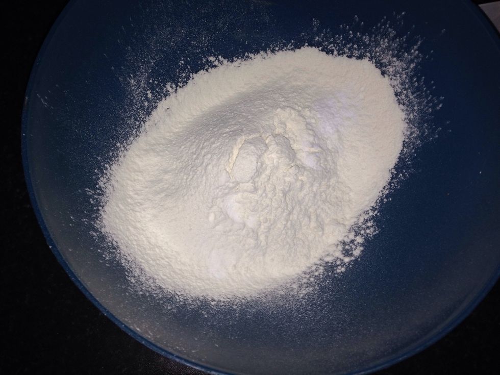 Like so, then add your blueberries, caster sugar, lemon zest and mix well