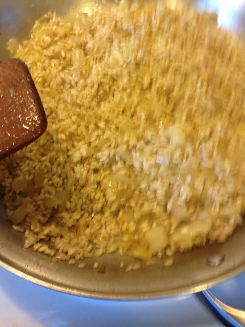 Like so, wine is all gone, alcohol burned off and only the great flavors of the wine! From here on out, don't worry if while cooking the rice sticks a bit to the pan, it will deglaze with the stock