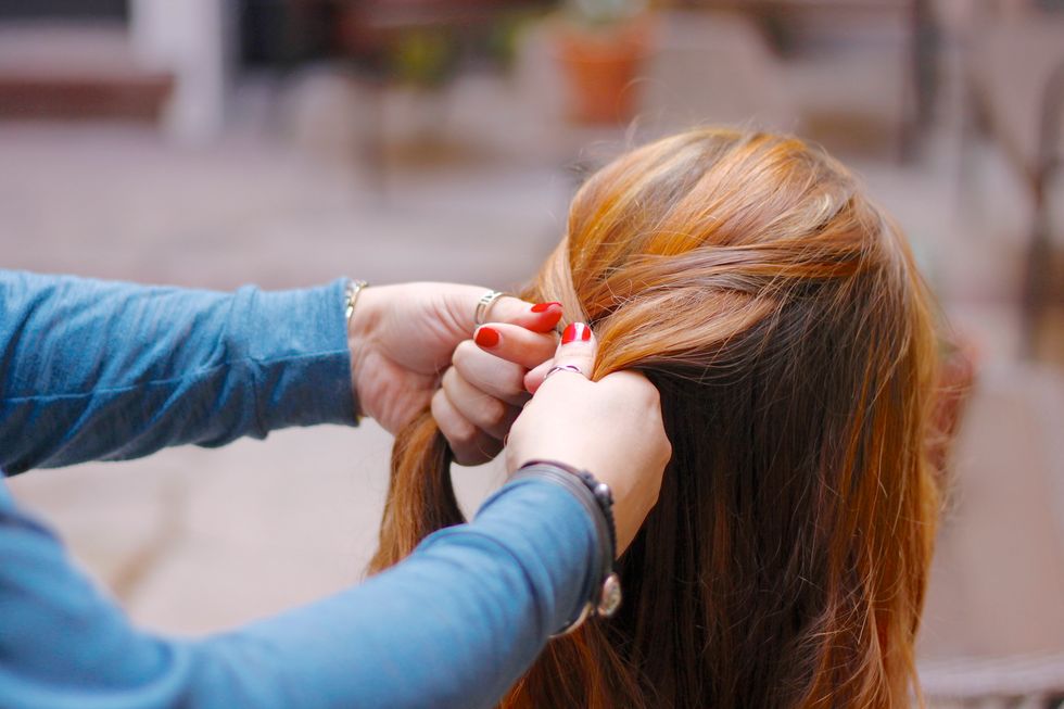 ...Like so. Work with the hair in your hands until you start getting some shape. Once the braid starts to take shape, then you can incorporate more loose hair as you go.