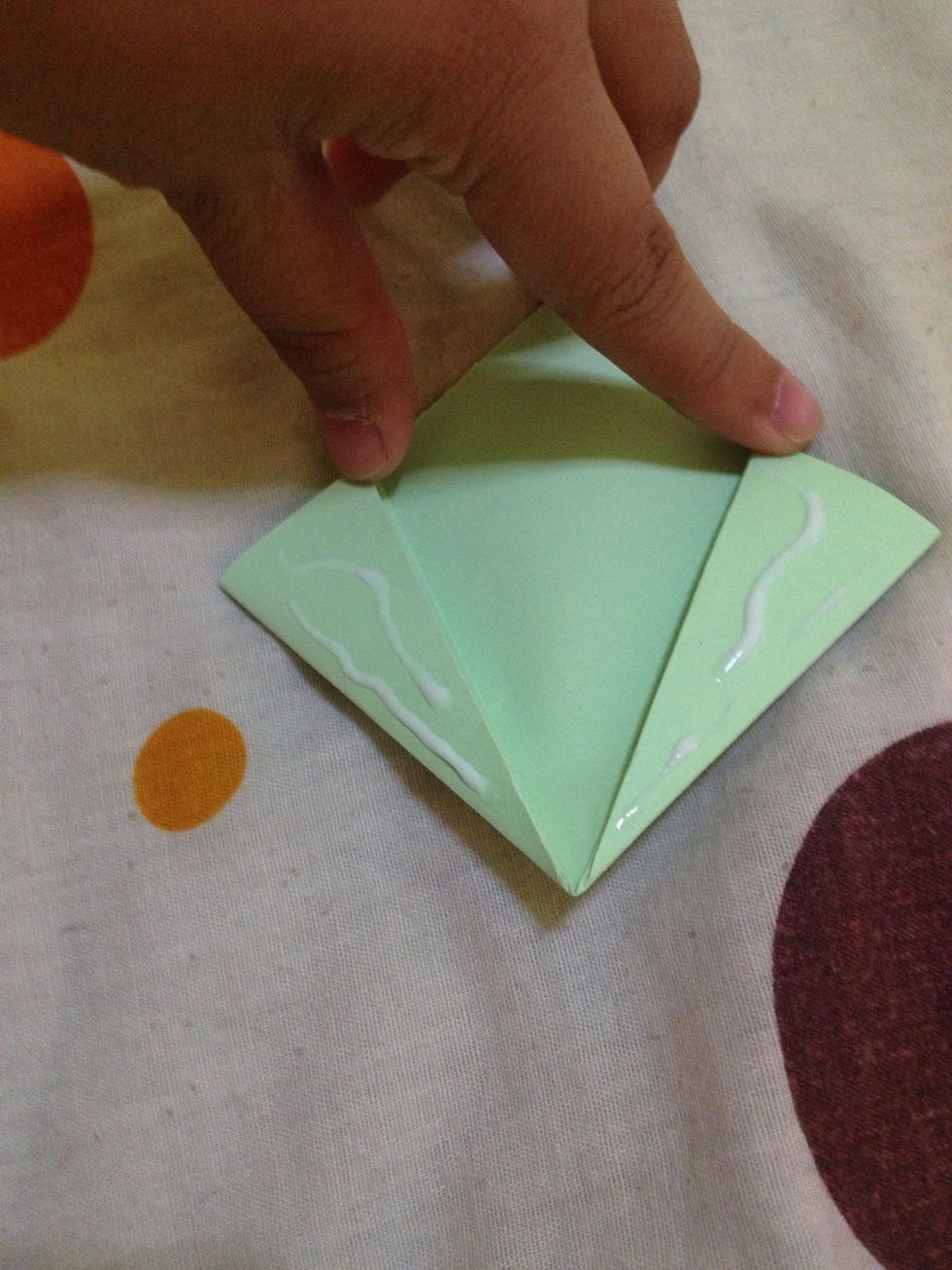 Like this. Any glue will do. Then, hold them together till it dries.