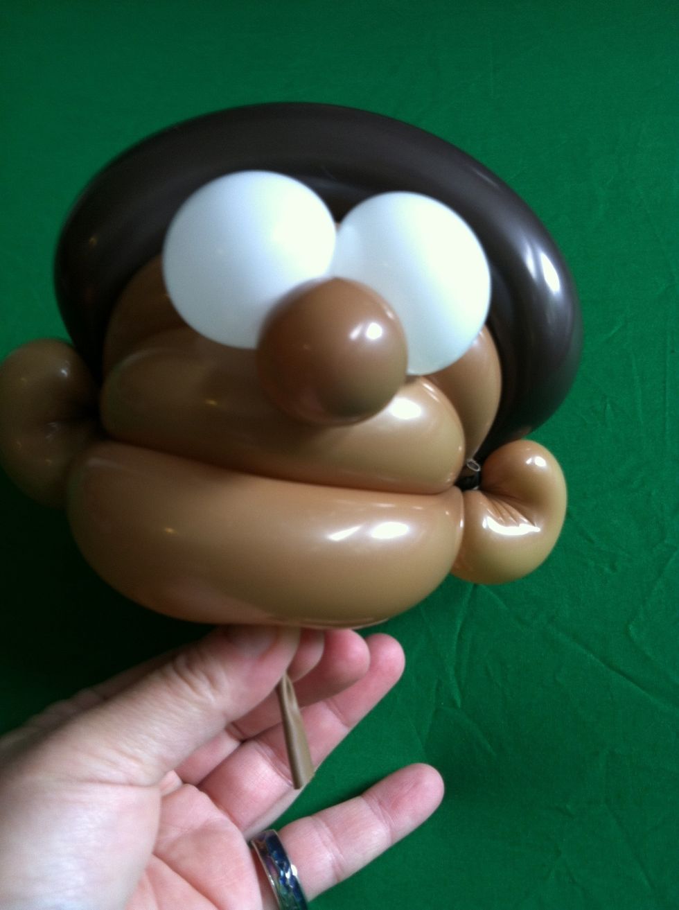 Like this...  Be sure to pull out the tail from the nose as this is how you will attach the head