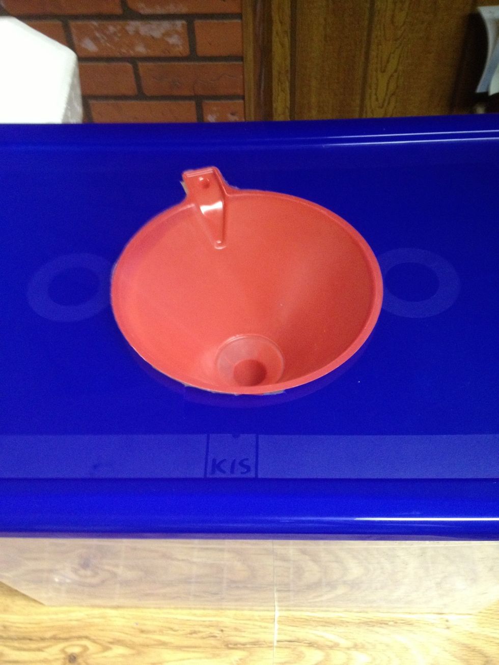 Like this! Don't affix the funnel yet, because the next step is to enlarge the opening at the bottom by cutting off the end. A hole about 2.5" wide is about perfect.