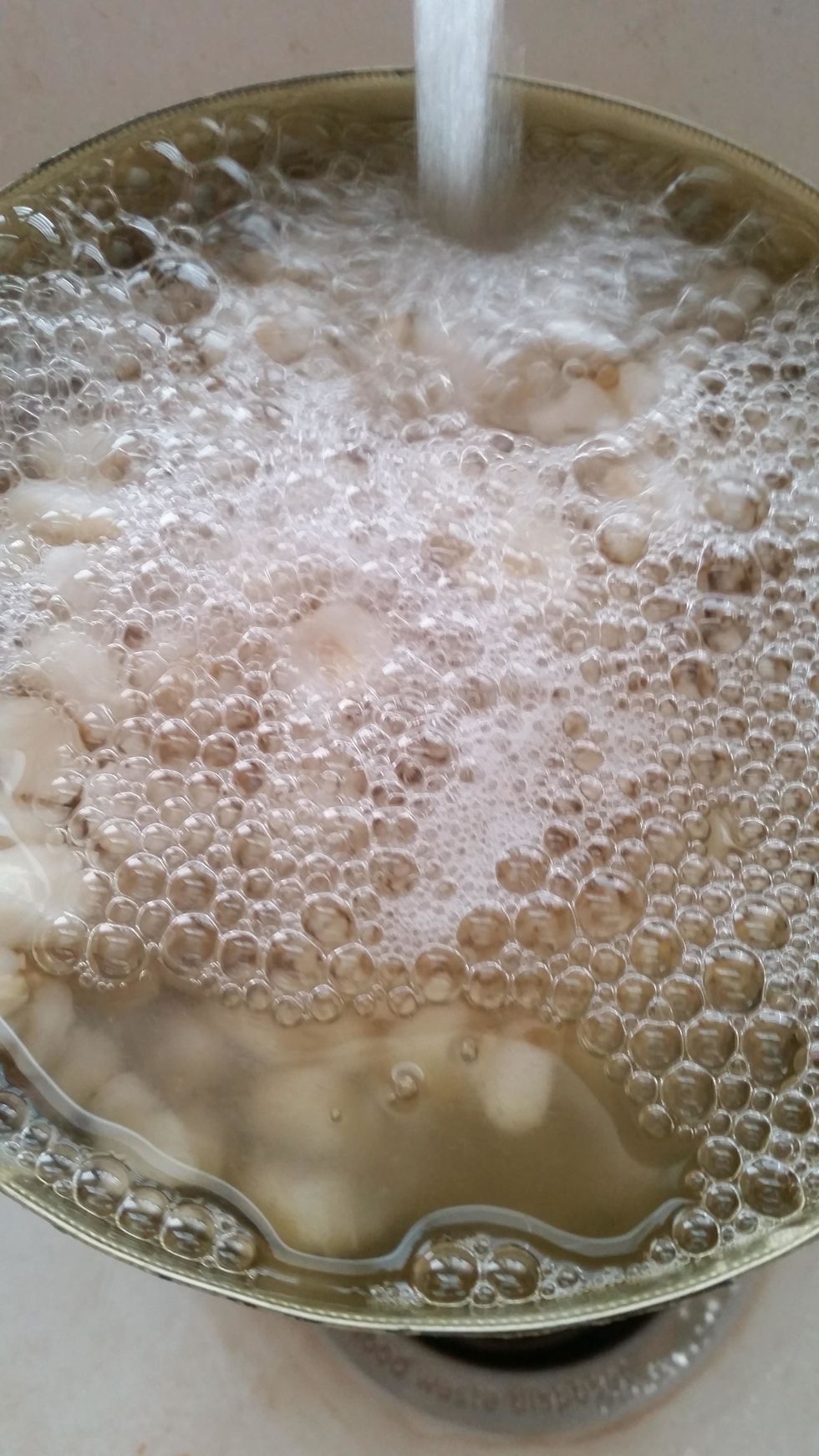 Like this! Swish it around a bit.... it's for rinsing purposes. Then pour it out again.