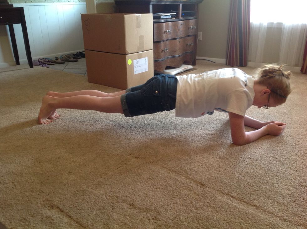 Like this. You can be on forearms for the traditional plank. Hold for 30 seconds.. Or 10... Or a minute.. However long you can or however long your kids let you. Do this twice.