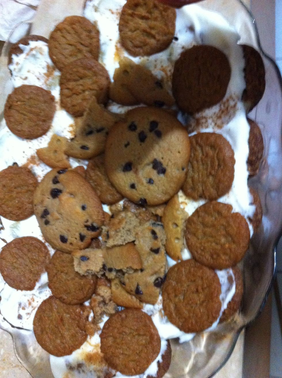 Like this. You can squeeze in the cookie crumbs too Cz it won't be seen thru cream cheese layer. Again sprinkle chocolate chips dark n white.I added Some walnuts here too with pineapple chunks