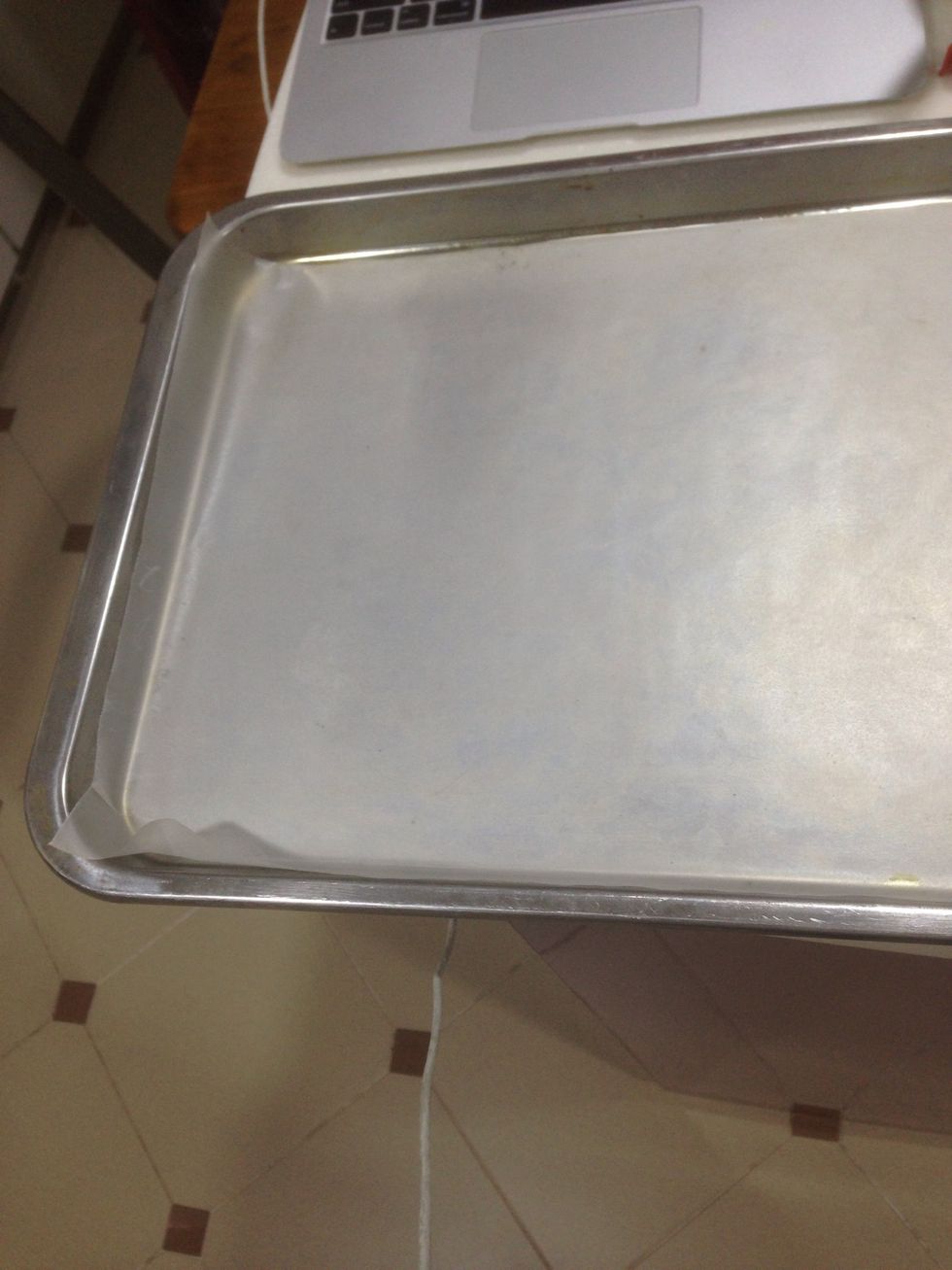 Line 2 baking trays with parchment paper