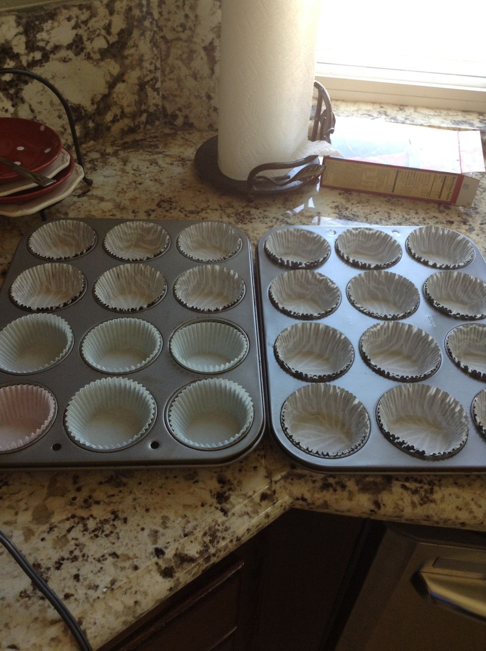 Line 2 cupcake pans with cupcake liners