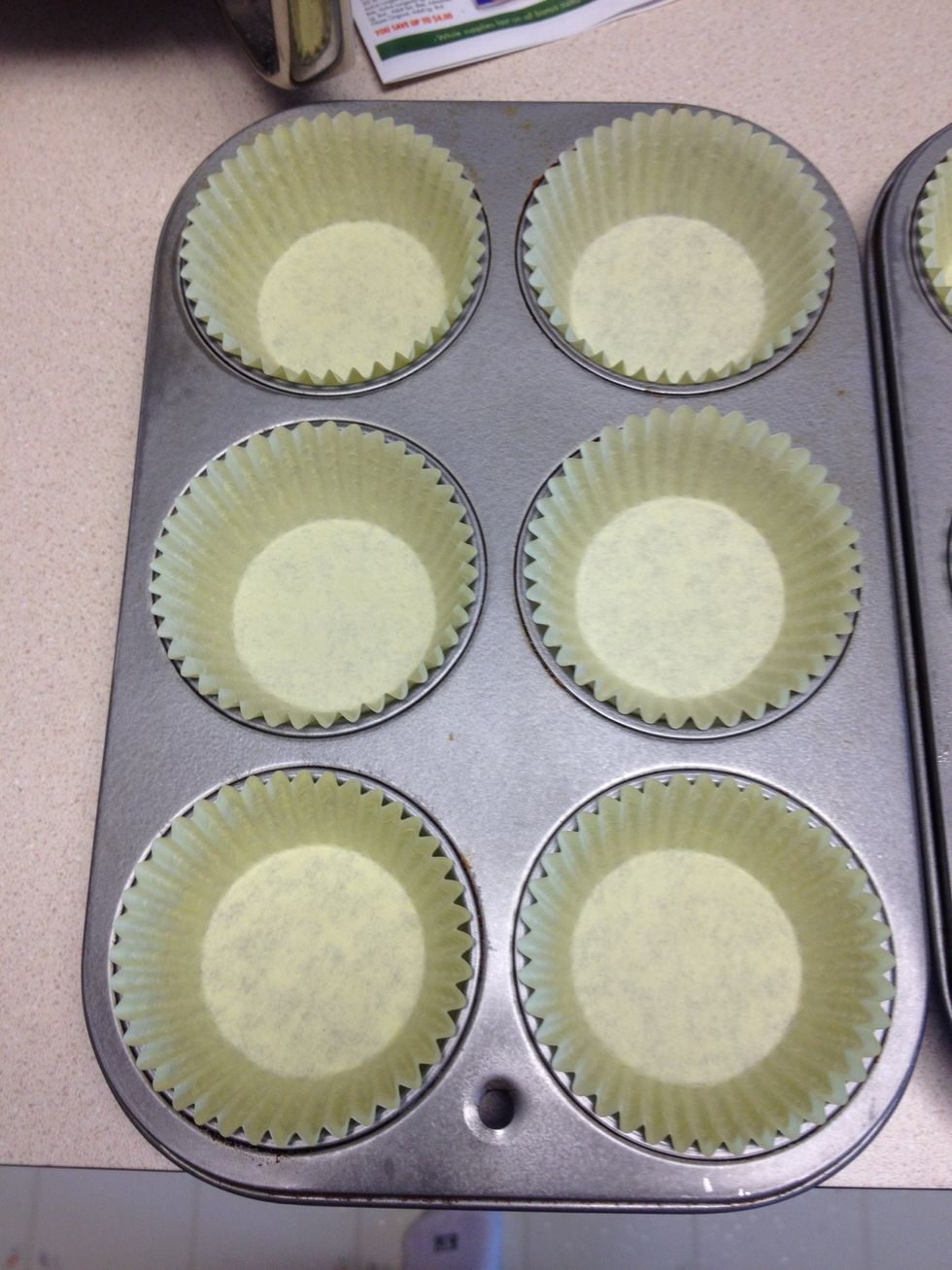 Line 24 cupcake tins with paper liners