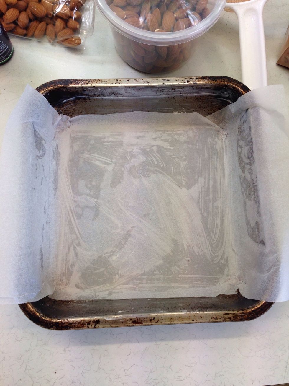 Line a 15cm x 15cm pan with baking paper.