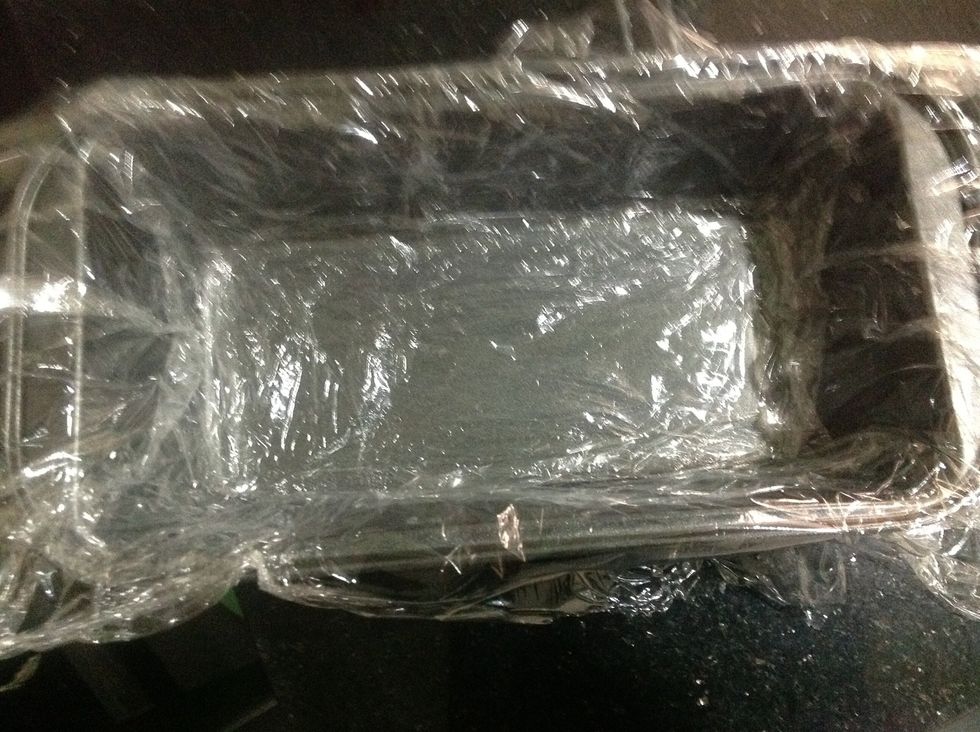 Line a 4x8" loaf pan with couple pieces of plastic wrap, making sure the pieces are large enough to overhang the sides of the pan.