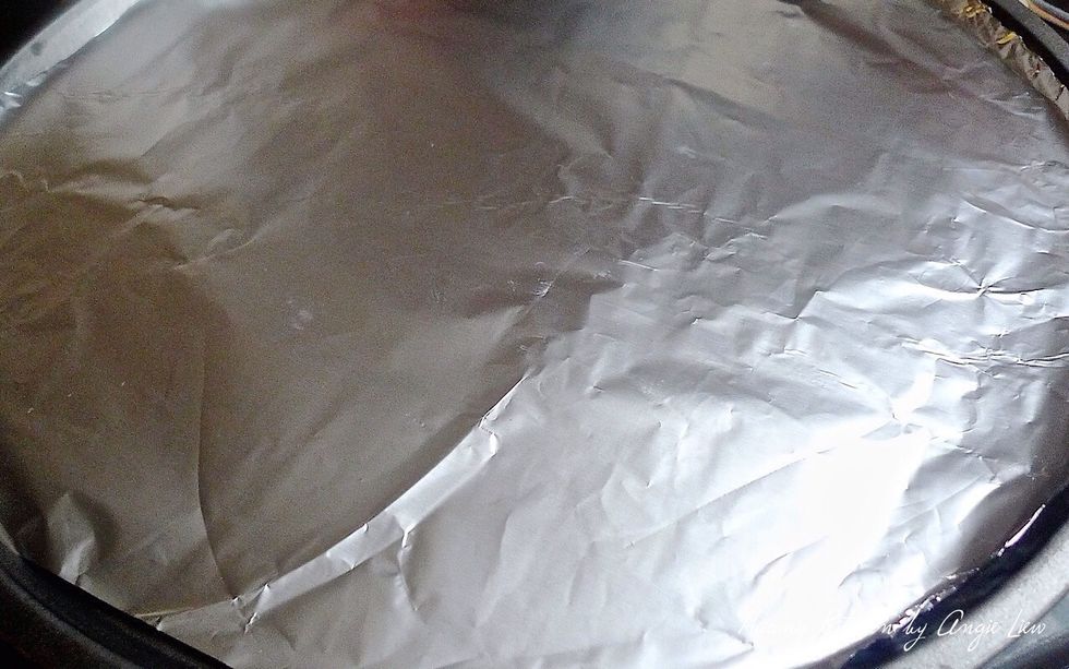Line a baking tray with aluminium foil.