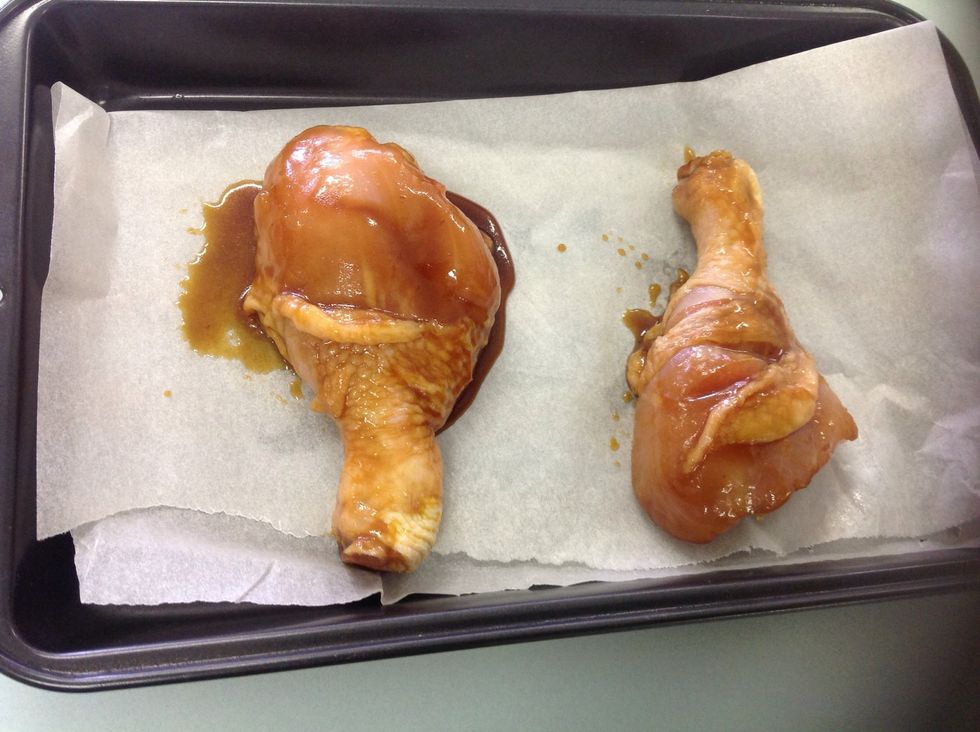 Line a baking tray with non-stick paper and place drumsticks on. Cook for thirty minutes while brushing with sauce at ten minute intervals.