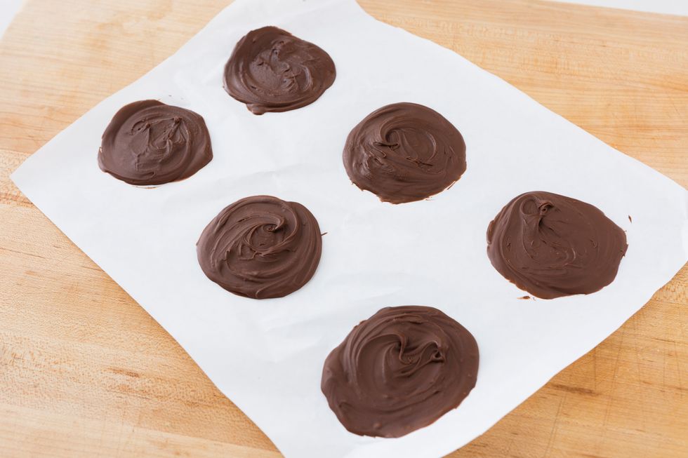 Line a cookie sheet with parchment paper. Add 1\u00bd to 2 tbsp of Nutella onto the tray and spread into a thin disk slightly smaller than a normal pancake. Freeze the discs for about 1 to 1.5 hours.