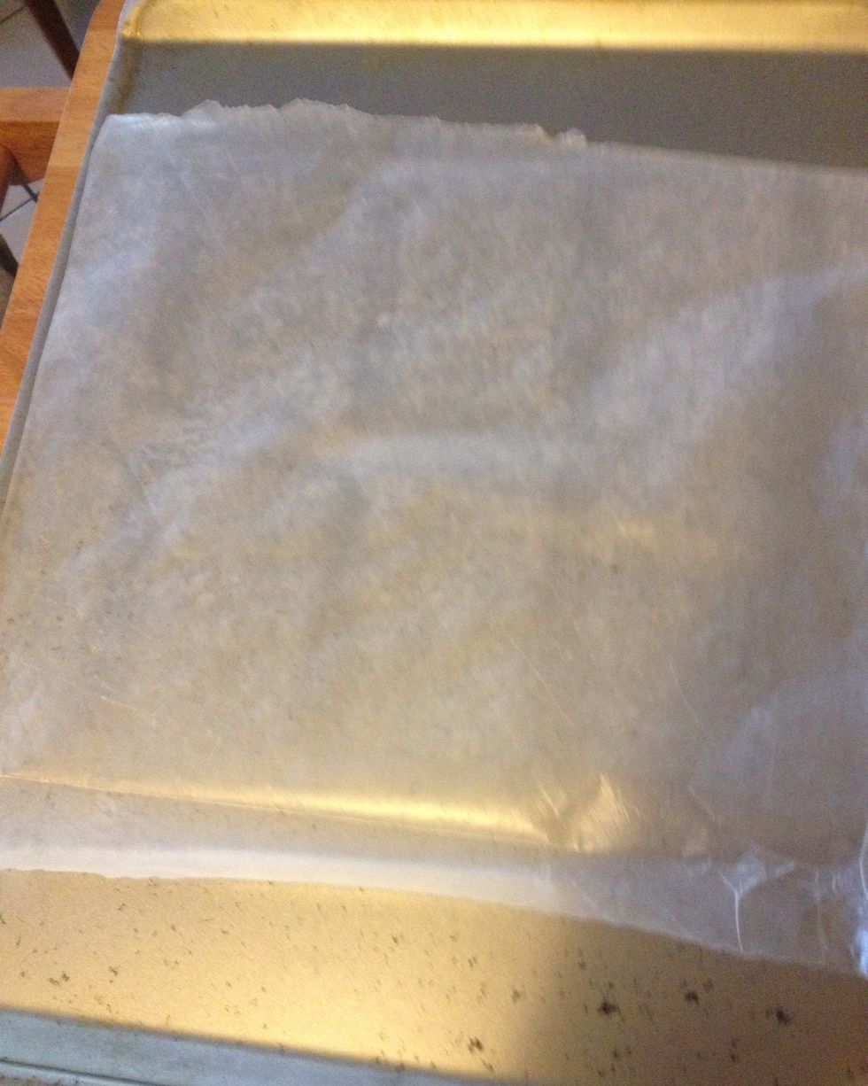 Line a cookie sheet with parchment paper and heat oven to 325F