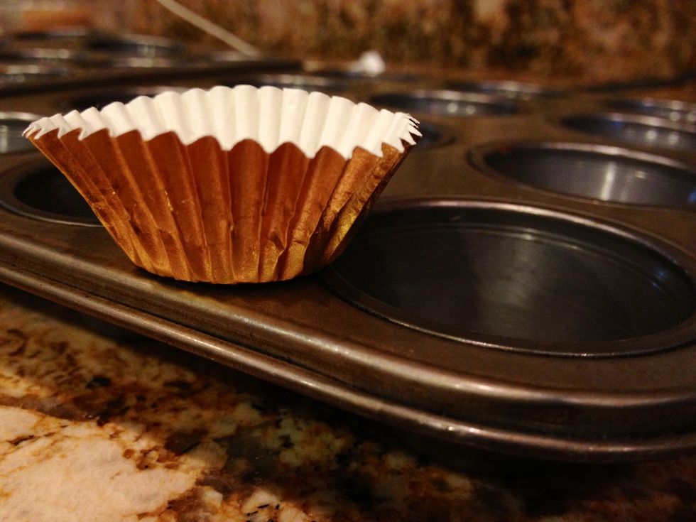 Line a mini muffin tin with baking cups.