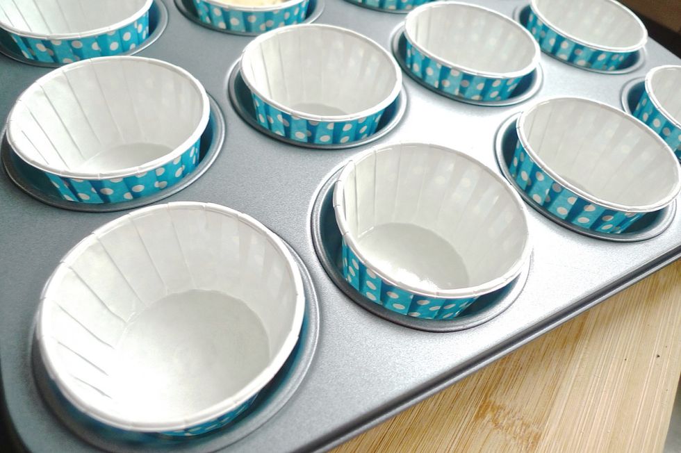 Line a muffin pan with cupcake liners, preferably blue in line with the theme.
