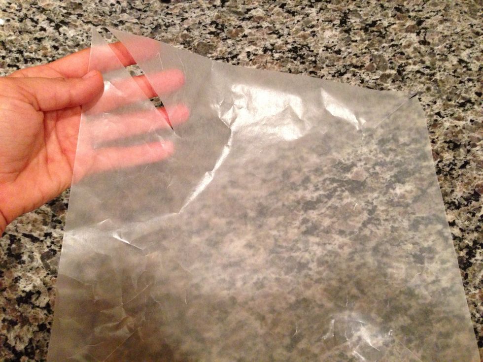 Line a pan with wax paper. I'm using a 9" baking dish, but anything can work. If you cut each corner like this, it'll mold right into place. Otherwise, you can just mash it in. The bars will not mind.
