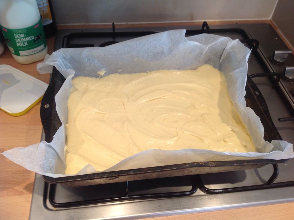 Line a rectangle baking tray with baking paper and add the mix trying to get as even as possible