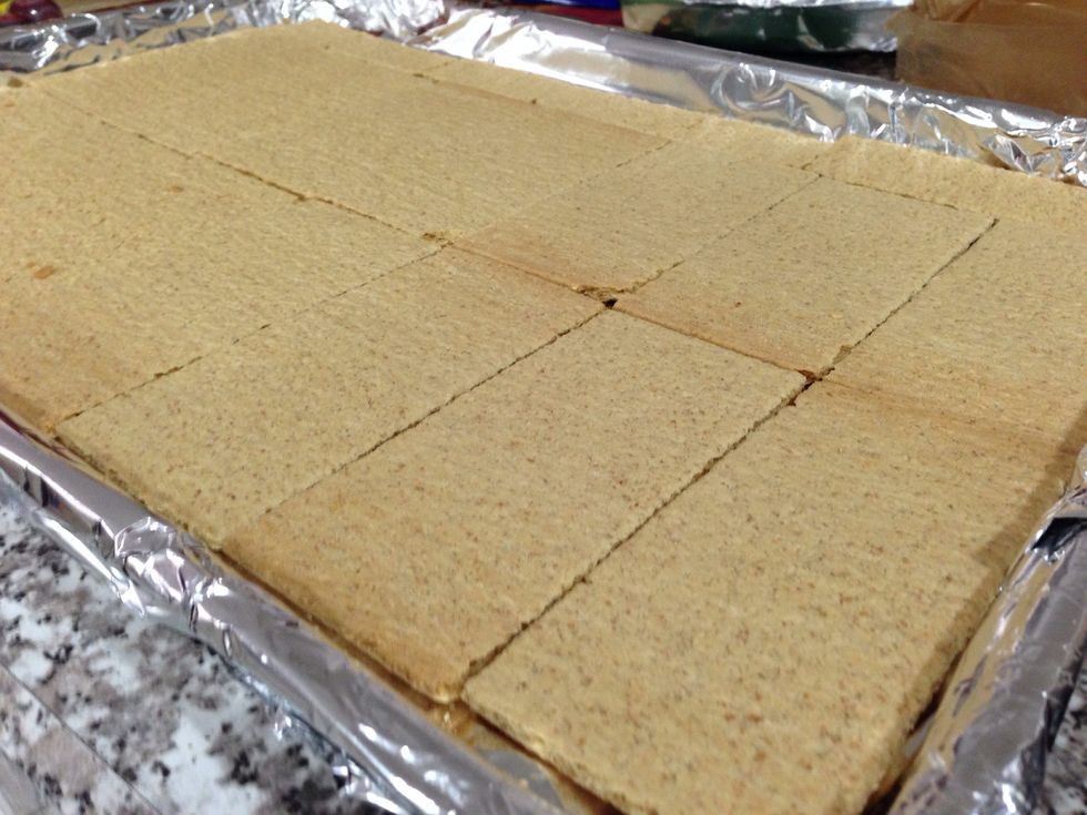 Line a sheet tray with foil. Then line with graham crackers. I used about 16 and I had to cut some in half to put along the edge!