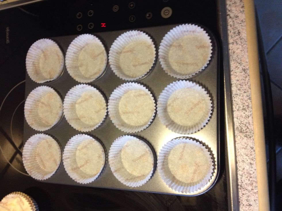 Line a standard muffin tin with paper liners