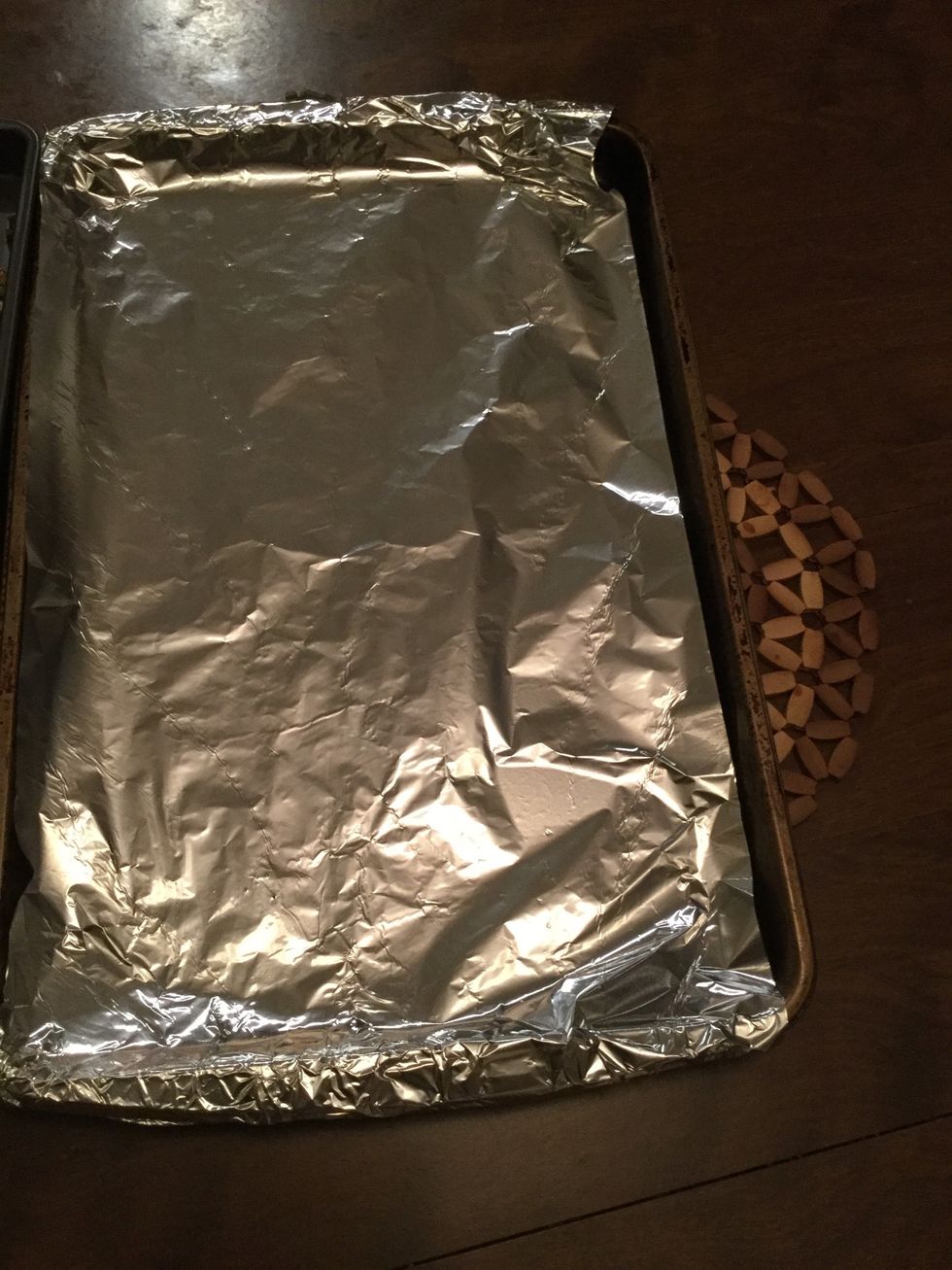 Line another baking sheet with foil and then grease with Pam