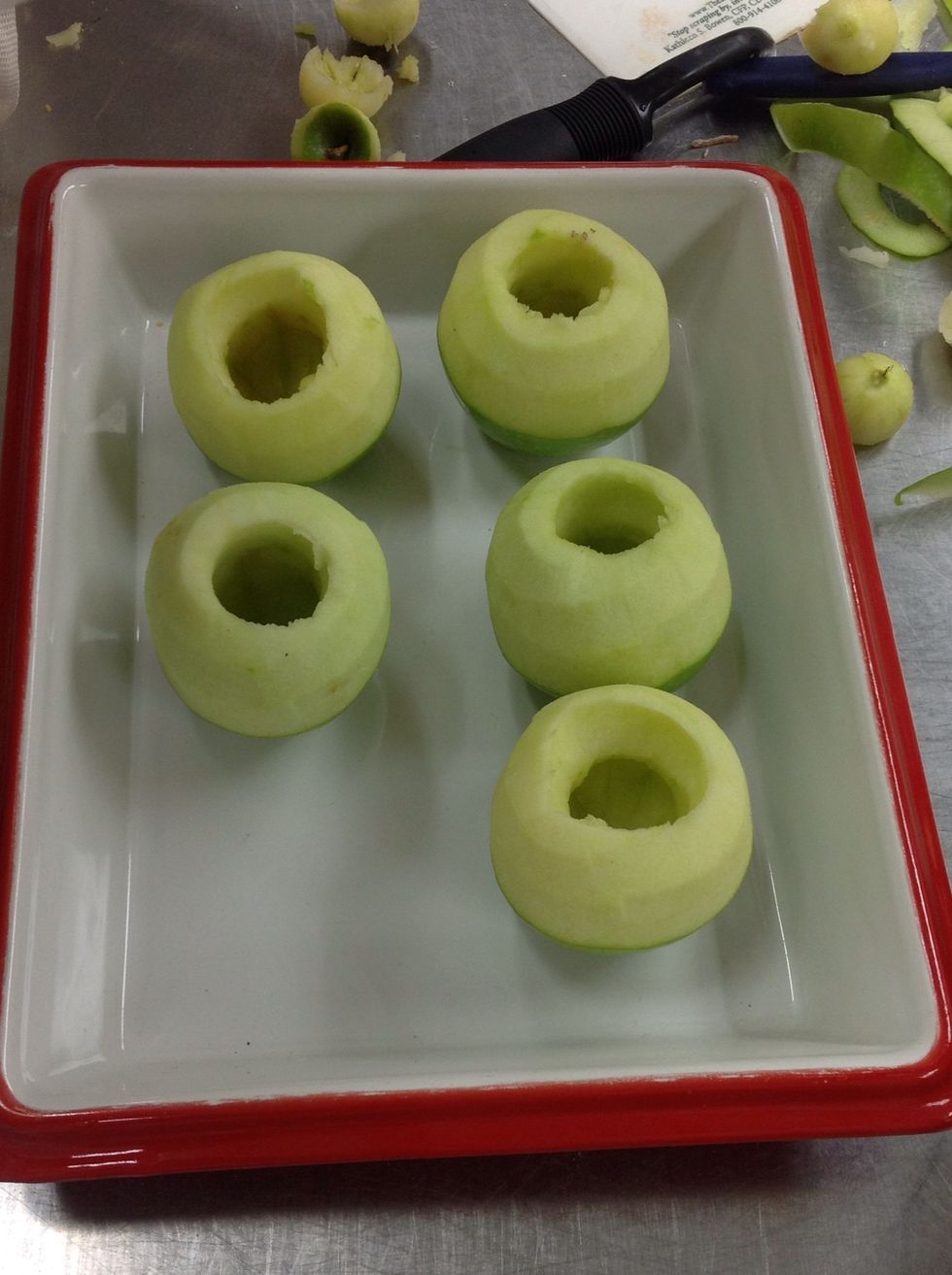 Line apples in a cooking dish.