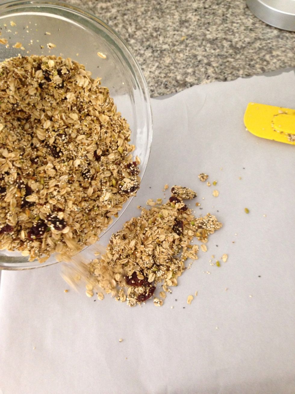 Line baking sheet with parchment paper (this is not necessary, but makes everything easier), then pour granola all over the baking sheet.