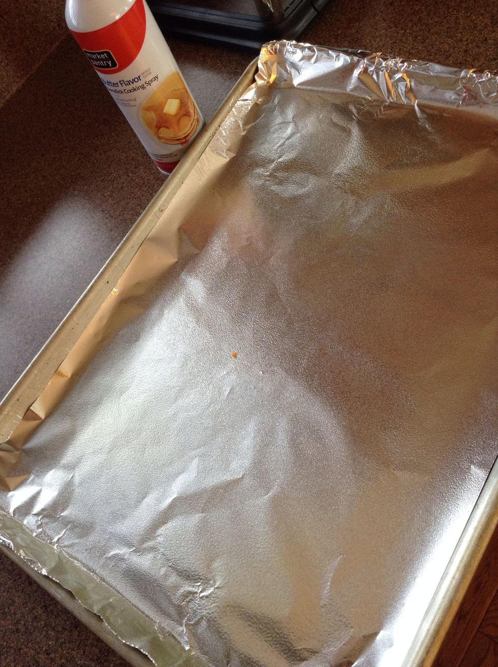 Line baking sheet with tin foil, spray
