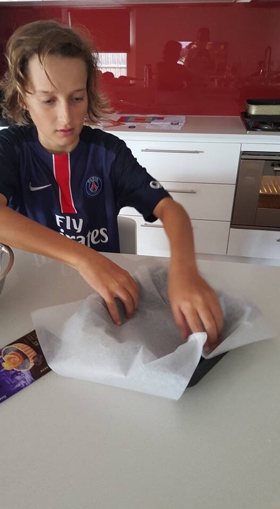 Line baking tin with baking paper