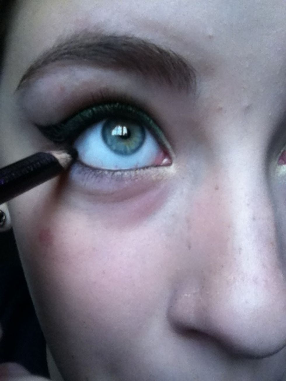 Line both your upper and lower water line with a black kohl pencil.