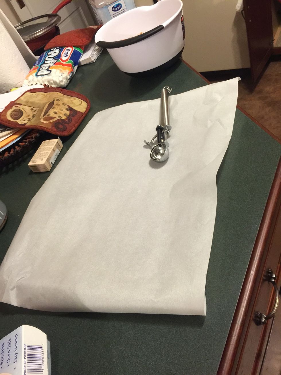 Line cookie sheet pan with parchment paper to put cookies on
