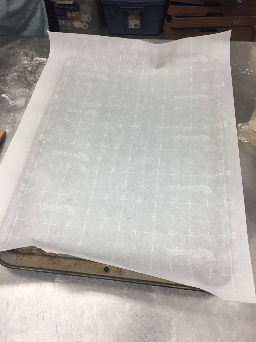 Line cooking pan with parchment paper