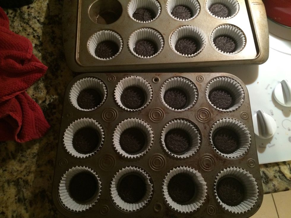 Line cupcakes tin put  1 whole Oreo in bottom