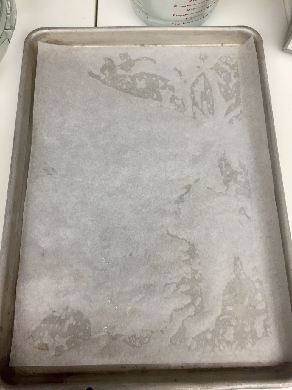 Line sheet tray with parchment paper.