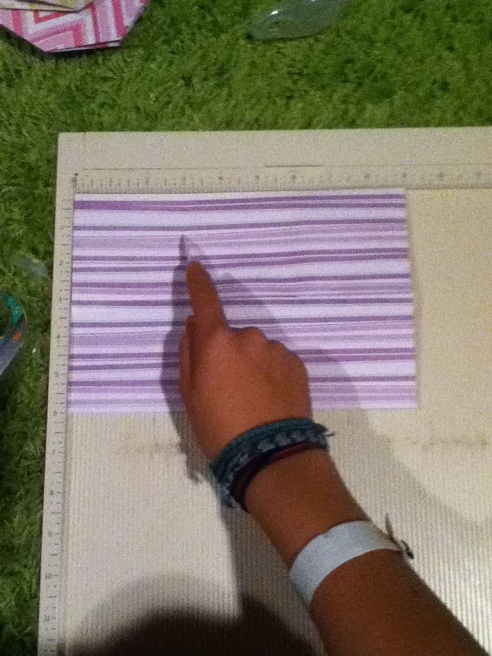 Line side B up with the side of the scoring board, and score at 3 inches. ( side B is on the left).