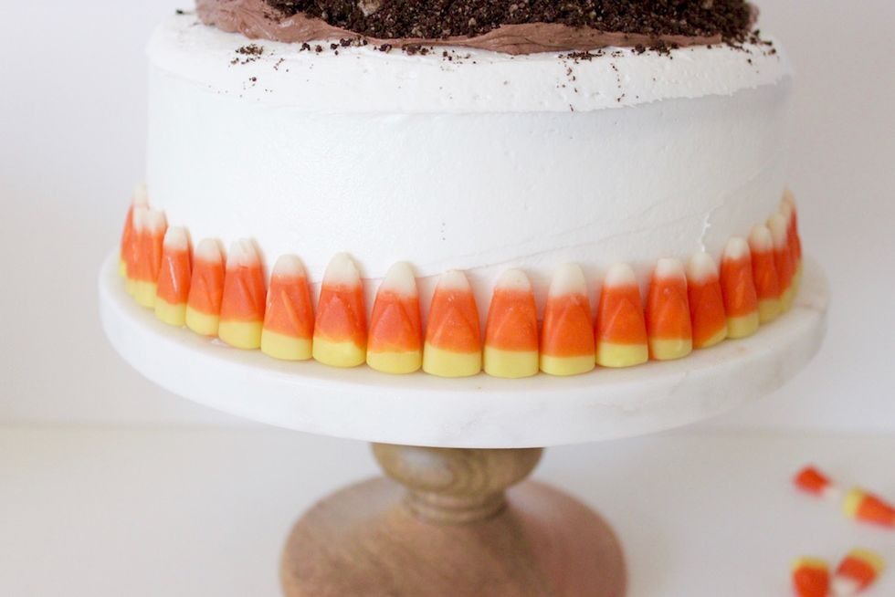 Line the base of the cake with candy corn for some added color and texture.
