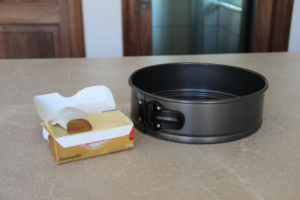 Line the base of the tin with butter