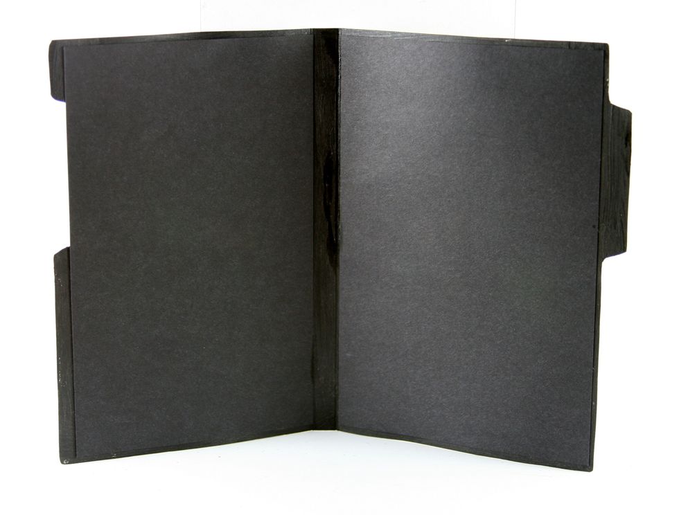 Line the inside of the book with black cardstock. Cut the piece for the left at 3 5/8 x 6 inches and the right 4 x 6 inches. Attach with sturdy double stick adhesive tape.