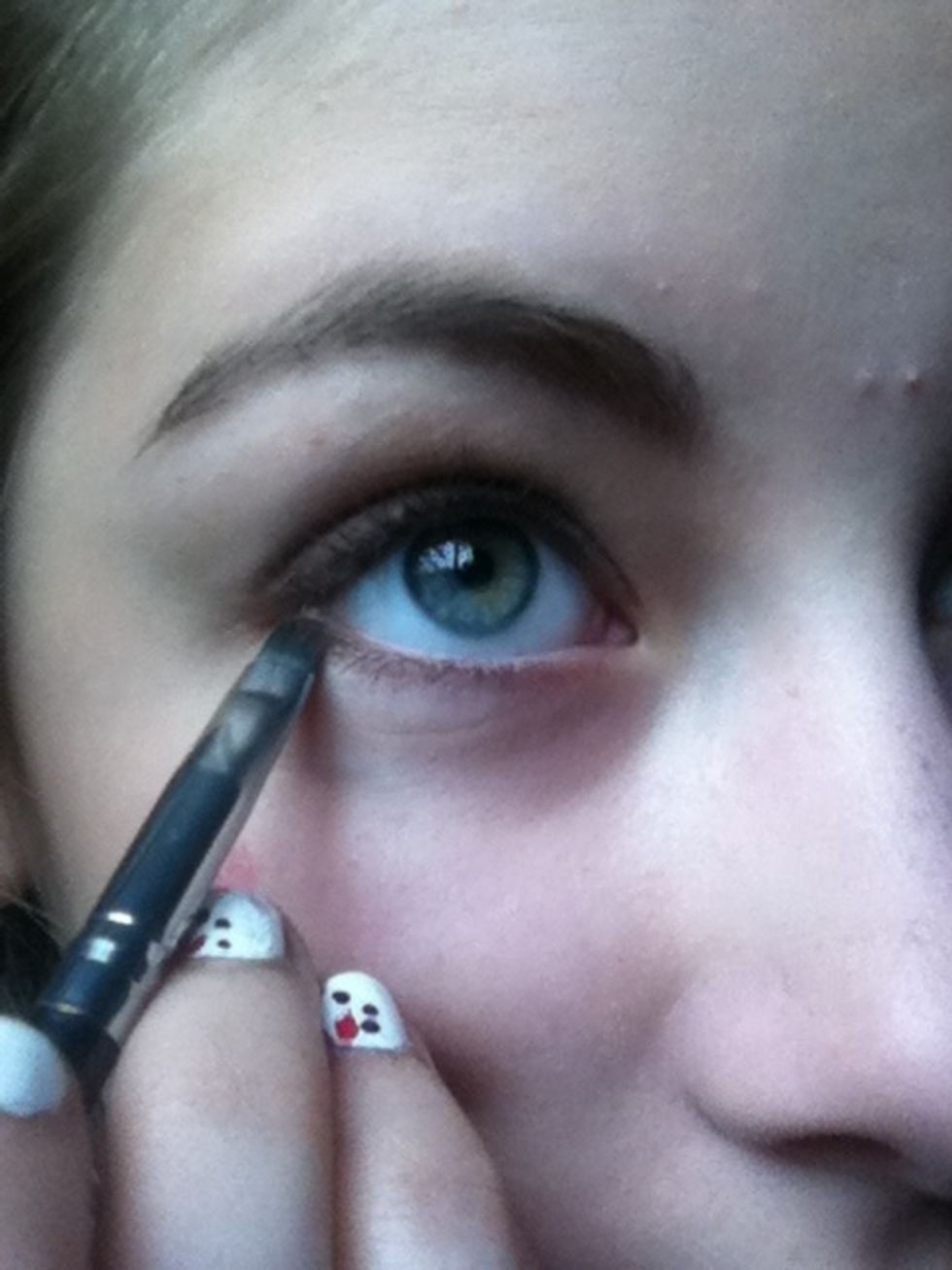 Line the lower lashline with dark brown