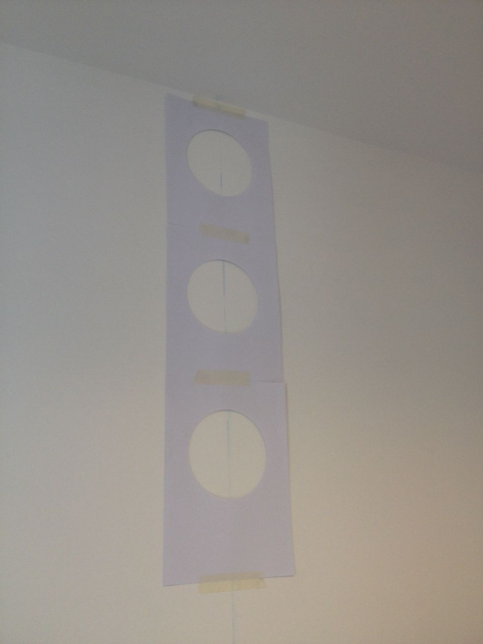 Line the sheets of A4 in the centre of the wall