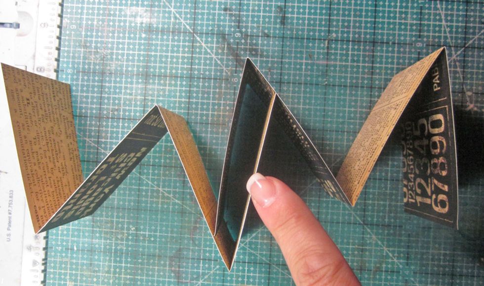 Line the two folded pieces together to make one long folded strip by gluing together.